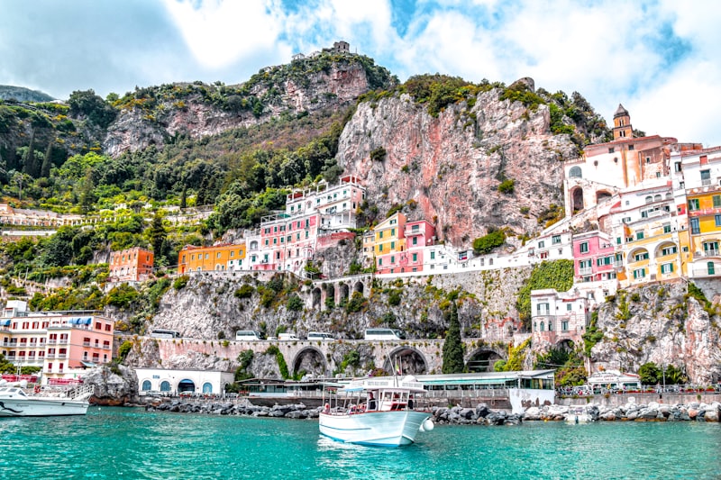 Cliffside pastel houses above the turquoise sea on the Amalfi Coast, Italy